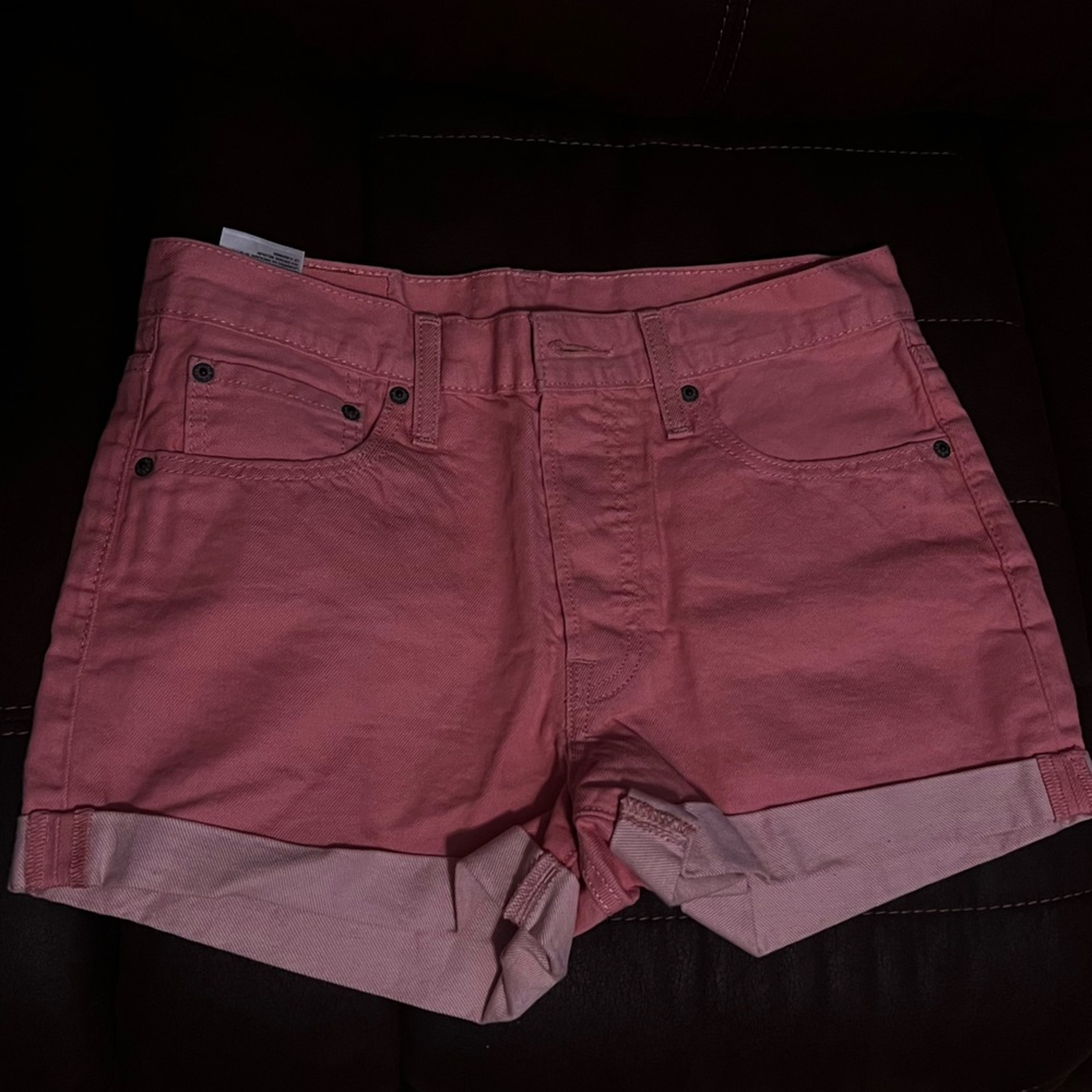 Pink Denim Levi shorts.